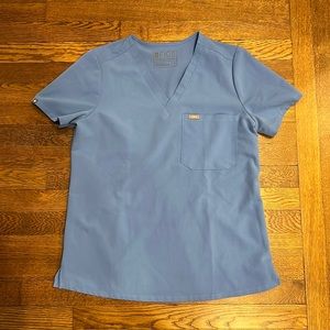 Light blue single pocket scrub top